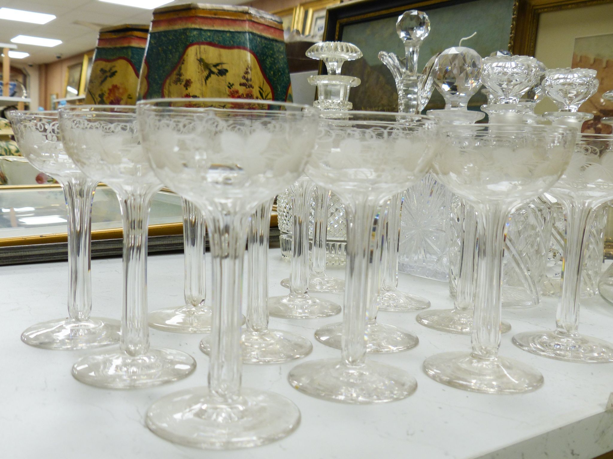 A Victorian diamond cut claret jug and decanter, assorted other decanters and champagne flutes